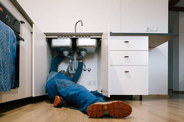 Professional Emergency Plumber technician working in Lake Mills, WI